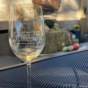 a glass of wine on a table