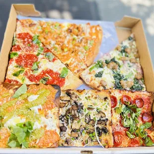 from top to bottom: margherita, buffalo chicken, romano, burata with pesto and vodka, mushroom and truffle oil, and grandma pepperoni