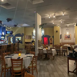 a restaurant with tables and chairs
