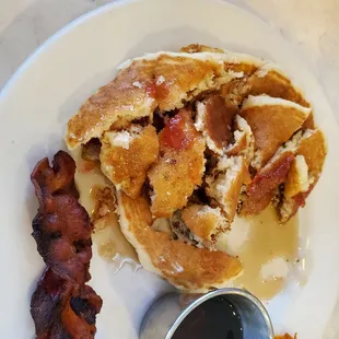 Kid&apos;s pancakes came with bacon (or sausage) and juice (or milk).