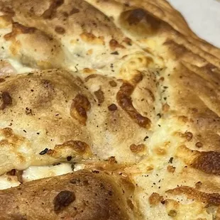 a piece of pizza in a box