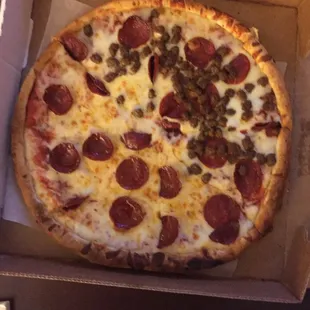 A small pepperoni and sausage pizza