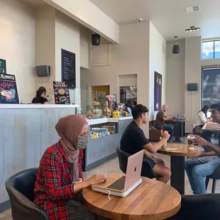a group of people sitting around a table