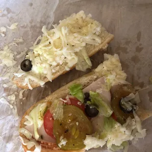 a sandwich with meat and vegetables