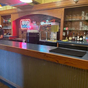 Behind the bar and check out