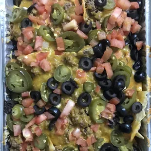 Nacho Supremo - can't really get to the nachos though because they're buried under all of these toppings, which makes them soggy.