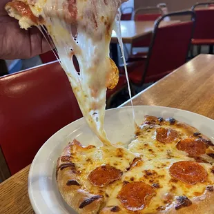 a slice of pepperoni pizza