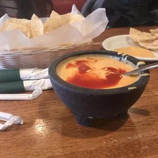 Queso and chips. P.s. add the hot sauce on the table it make it the bomb