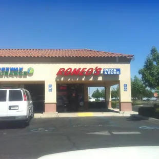 a car parked in front of the store