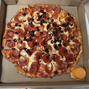 614 Pie (one half); Tuscan Pepperoni (second half) with black olives and thin crust