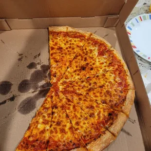 a half eaten pizza in a box