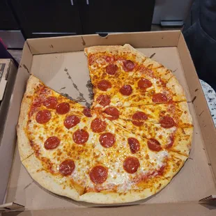 a half eaten pepperoni pizza