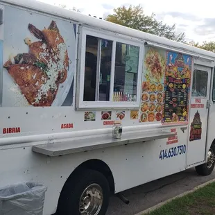 a food truck parked on the side of the road