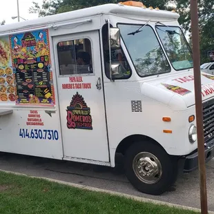 a food truck parked on the side of the road