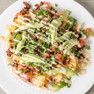 a plate of loaded nachos