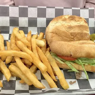 Philly cheesesteak with fries and pickle