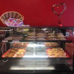 a display case filled with donuts