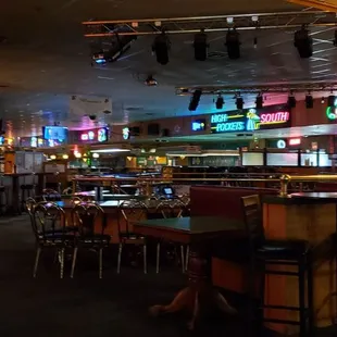 a bar with neon signs