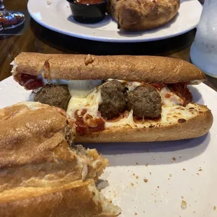 Meatball parm sub and Rómulo&apos;s House Calzone