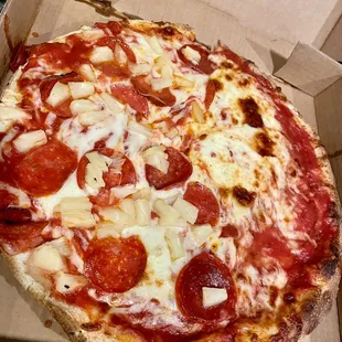 a pepperoni pizza in a box