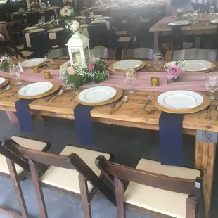 Our Rustic Farm Tables. Check our the laser cut initials on the table leg.