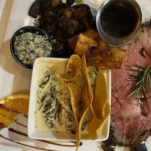 Prime rib with mushrooms, blue cheese, and creamed spinach.