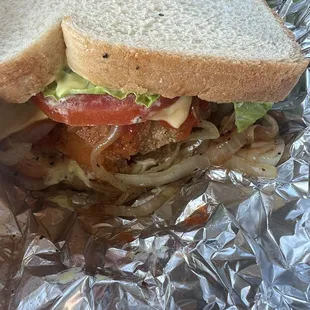 Whitting sandwich on white bread. W/fried onions, cheese, l&amp;t, HS &amp; tarter.THE OWNER Ron's Customer service was CHEF's KISS!