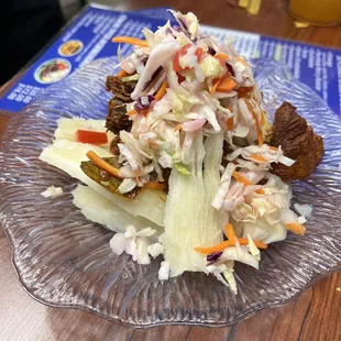 a salad on a glass plate