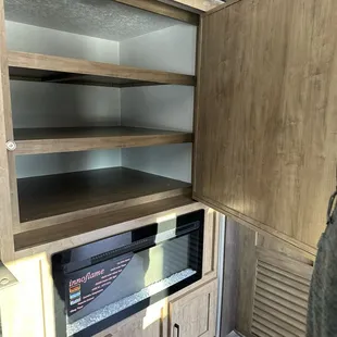 Hidden storage behind tv