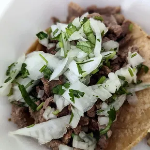 Mini taco with carne asada. They do not hold back on the meat, yassss