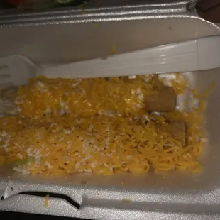 Grossness at its 3 Rolled Tacos with Cheese, Sour Cream and Queso stay away! I'll pay you to take it away and not serve me
