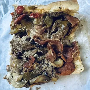 Large Steak and Cheese - Cooked Onion - Cooked Peppers  - Light Ketchup and Mayonnaise  - Pepperoni  - Becon  - Mushroom