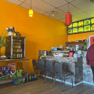 a woman standing in front of the counter