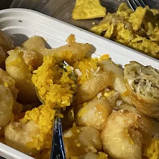 Coconut shrimp combo sliver-pen sized shells in rice  clear lacquered? and scant teaspoon of coconut Egg roll mushy garlic Crab Rangoon