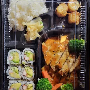 a bento box with a variety of food items