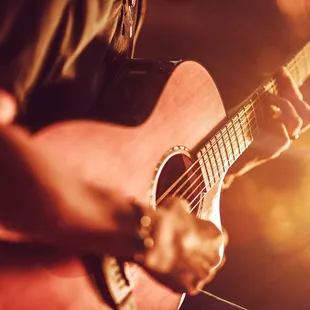 a man playing a guitar