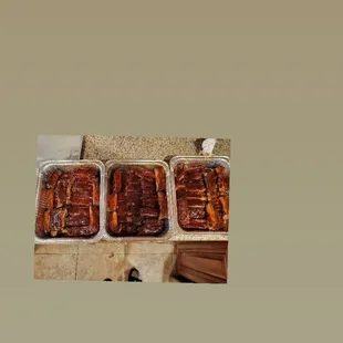 three pans of food on a table