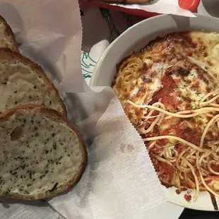 Garlic cheese bread and Chicken Parmesan (baked with half red sauce, half Alfredo).
