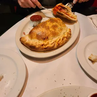 a woman eating a pizza