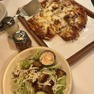 House salad with great dressing and medium pizza.