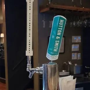 a beer being poured at the bar