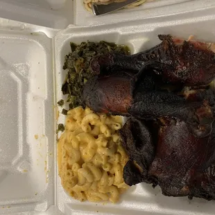 Smoked chicken, macaroni and cheese and collard greens.