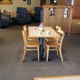 a dining area with tables and chairs