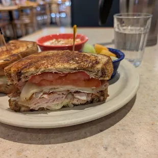 MARBLE RYE MAGIC - Grilled marble rye, grilled turkey, avocados, tomatoes, Jack cheese, grilled onions and homemade pesto mayo.