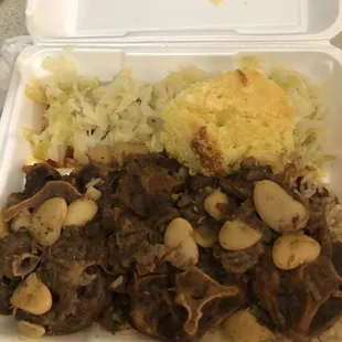 Oxtails , cabbage , rice &amp; corned bread .