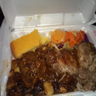 Ox tails, jerk chicken, cornbread, cabbage,  rice and peas