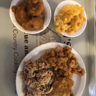 Macaroni and cheese, candied yams, fried shrimp, fried chicken and barbecue