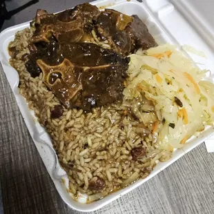 Oxtail, rice and beans and cabbage