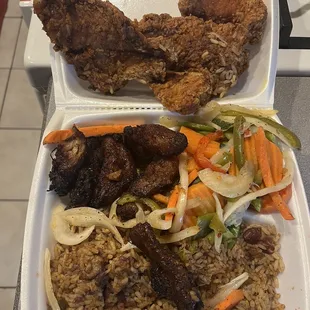 Fish, veggies, plantains, and rice.