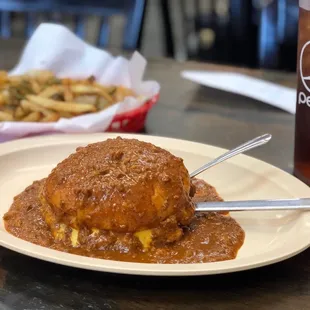 Cheeseburger with chili and Spanish fries